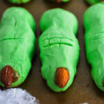 Witch Finger Cookies lying flat on a baking sheet.