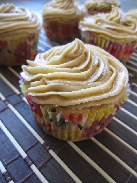 These Vanilla Bean Cupcakes with Peanut Butter Frosting are the perfect dessert recipe. Moist cupcakes with a peanut butter cup inside.
