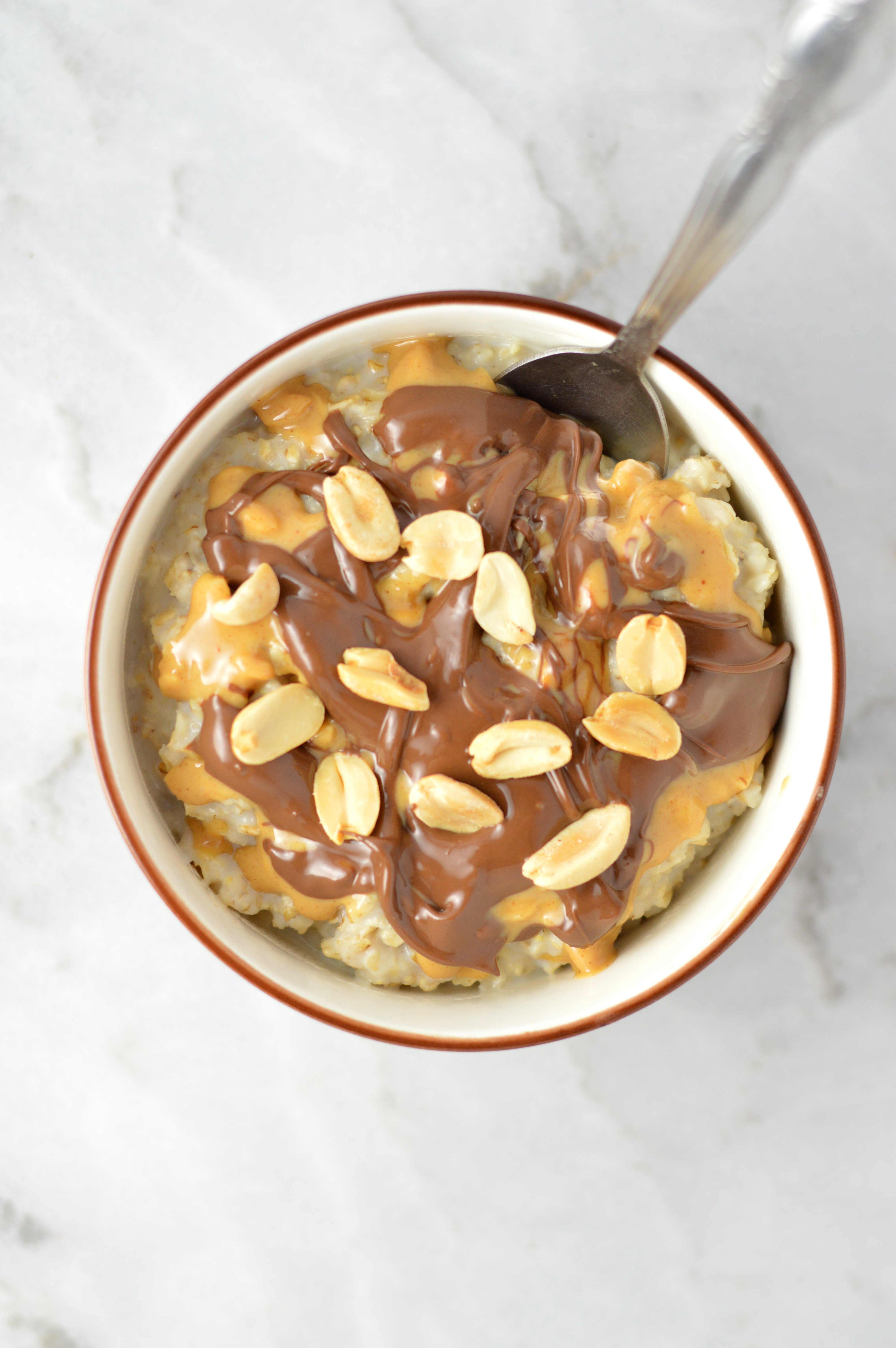 https://www.atasteofmadness.com/wp-content/uploads/2014/11/Peanut-Butter-Nutella-Microwave-Oatmeal-3.jpg