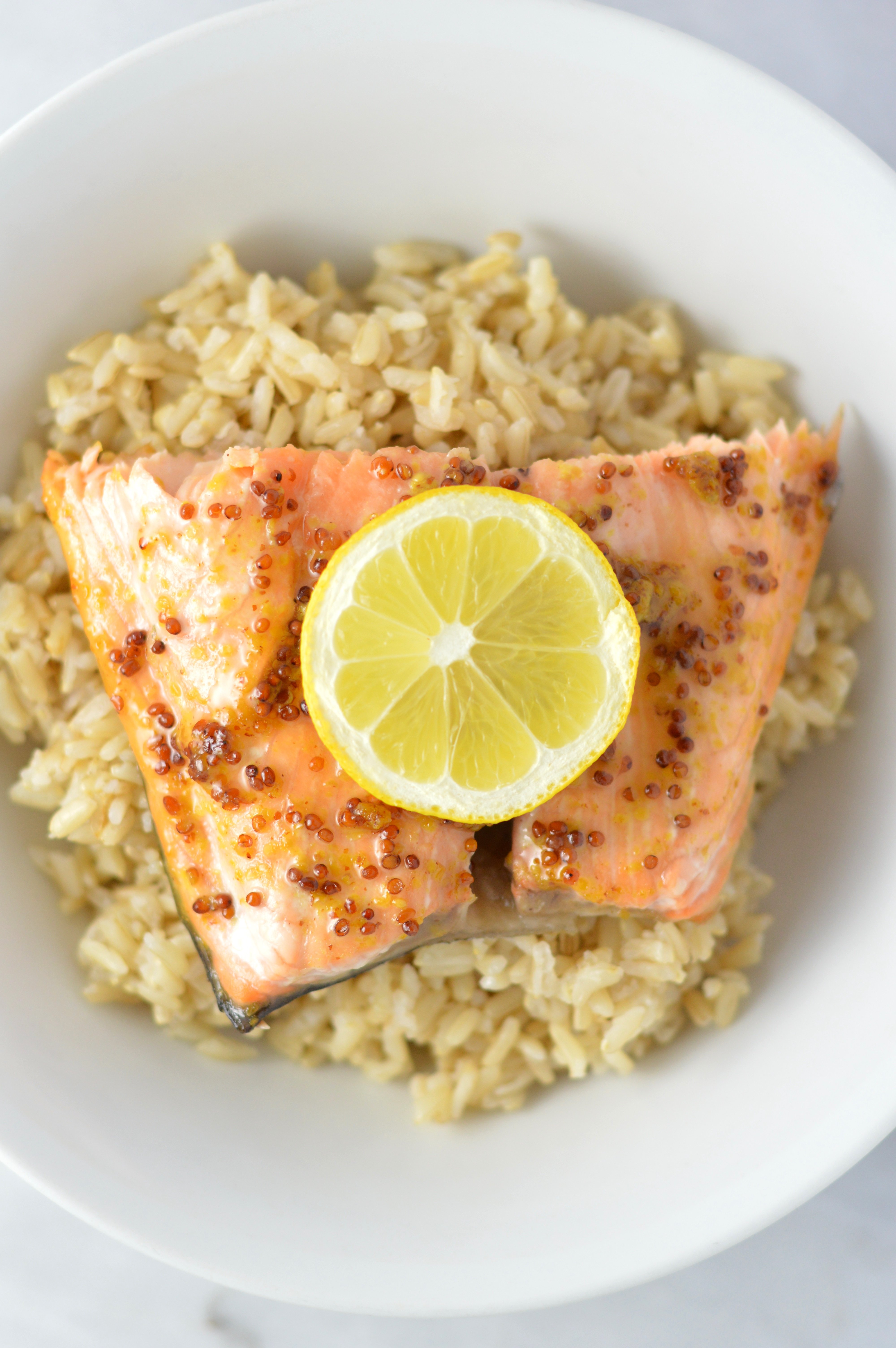 Quick and easy Honey Dijon Mustard Salmon recipe for a weeknight meal that is ready in under 20 minutes. My new go-to dinner idea!