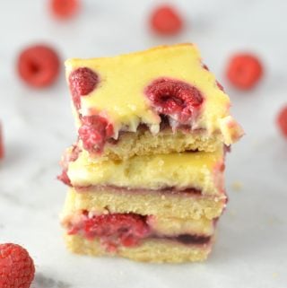 Easy Raspberry Cream Cheese Bars recipe. Made with fresh raspberries on top of a shortbread crust, tastes almost like cheesecake.