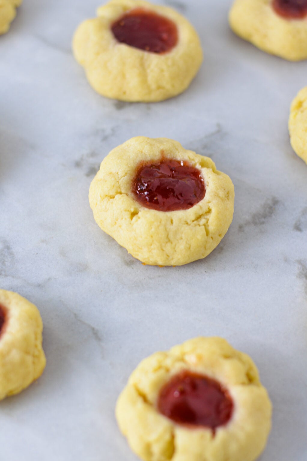 Raspberry Cream Cheese Thumbprint Cookies - A Taste of Madness