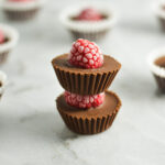 A stack of mini Raspberry Nutella Cups, with the red raspberries all frosty from being in the freezer.