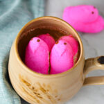 Easter themed Peeps Coffee, topped with bright pink Peep marshmallow chicks.
