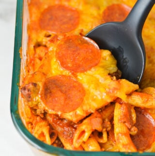 Freshly Baked Pizza Pasta in a large casserole dish, with crispy pepperoni and melted cheese on top.