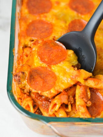 Freshly Baked Pizza Pasta in a large casserole dish, with crispy pepperoni and melted cheese on top.