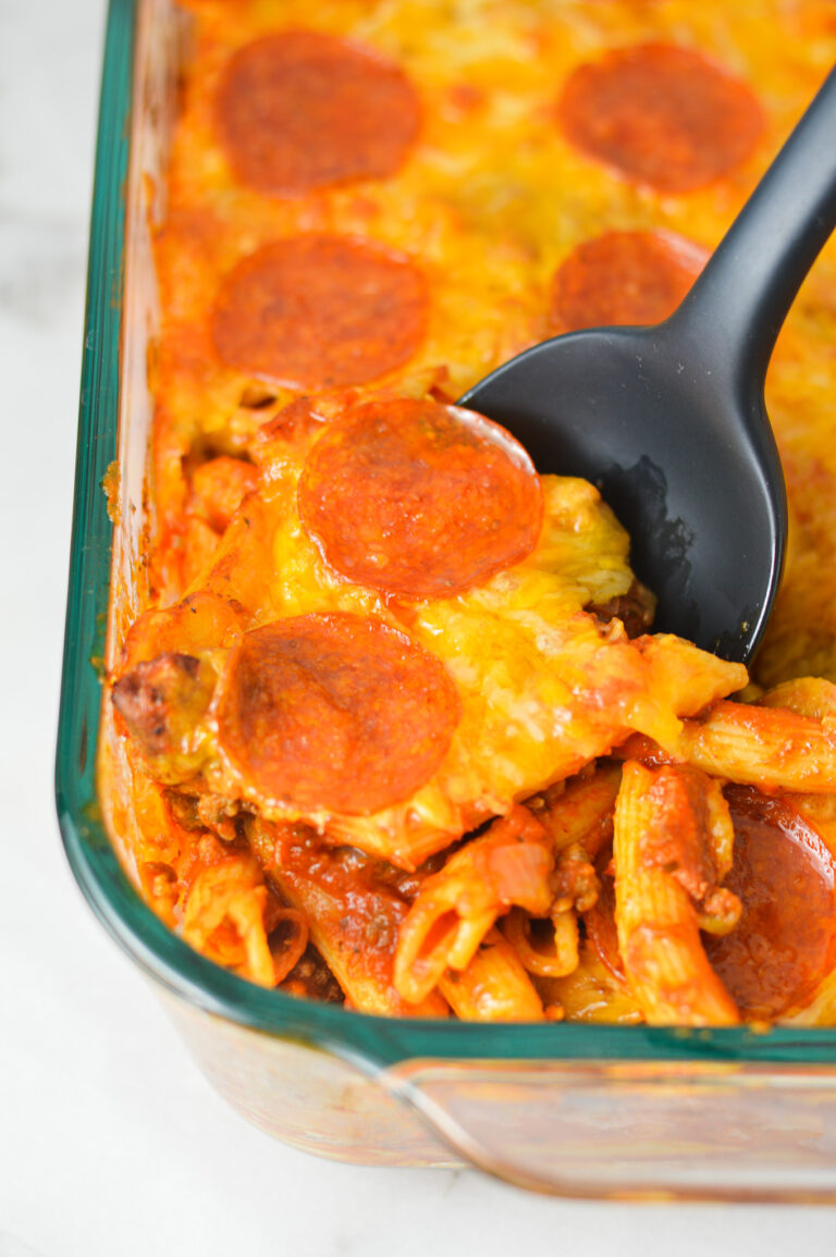 Freshly Baked Pizza Pasta in a large casserole dish, with crispy pepperoni and melted cheese on top.