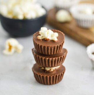 A stack of Popcorn Nutella Cups with the paper liners taken off to show the creamy texture.
