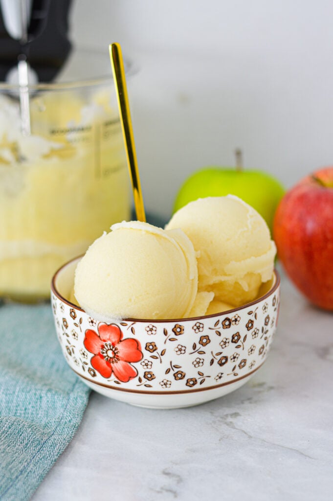 A small bowl with scoops of Apple Italian Ice made from the Ninja Creami machine.
