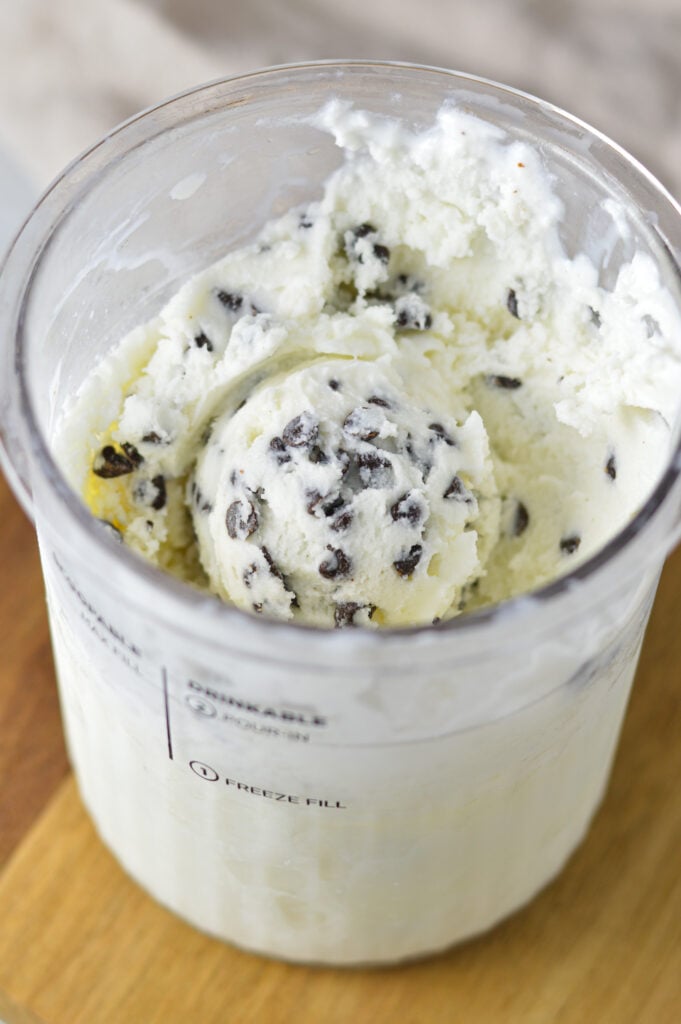 A Ninja Creami Pint filled with Ninja Creami Chocolate Chip Ice Cream, with mini chocolate chips distributed evenly in the smooth ice cream.