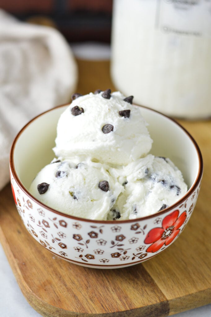 A small bowl filled with creami chocolate chip ice cream made in a Ninja Creami machine.