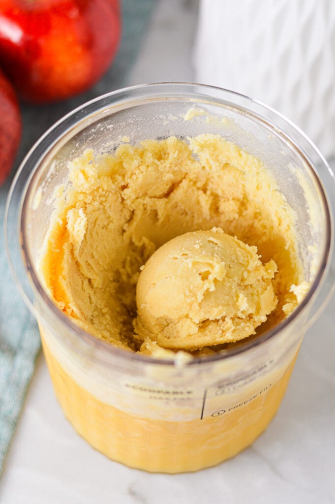 A Ninja Creami container filled with Ninja Creami Caramel Apple Sorbet.