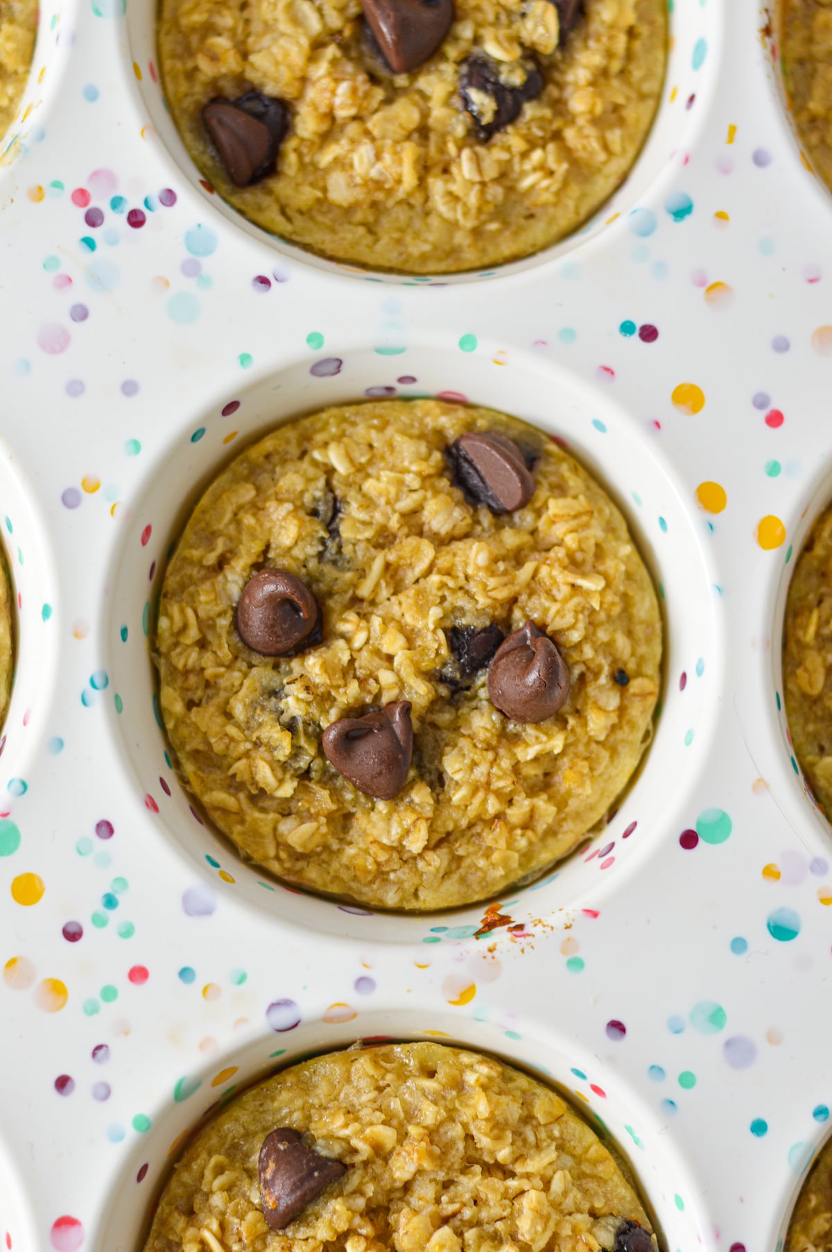 Freshly baked Chocolate Chip Baked Oatmeal Cups in a silicone muffin pan.