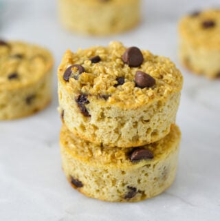 A stack of Chocolate Chip Baked Oatmeal Cups, with the rich chocolate chips sticking out of the nutritious oatmeal cups.