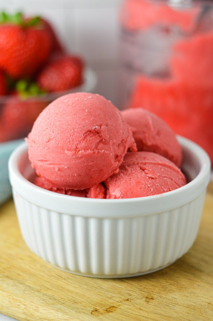 Scoops of Ninja Creami Strawberry Sorbet in a small ramekin, showing the creamy texture of the refreshing sorbet.