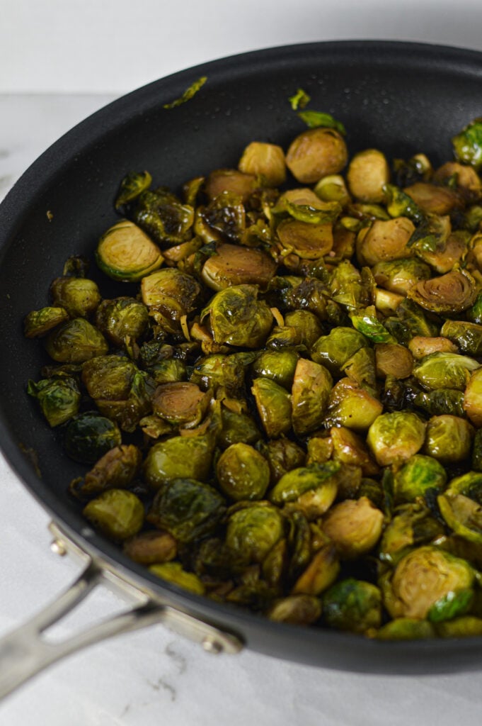 Freshly made Stovetop Balsamic Honey Brussels Sprouts in a large skillet.