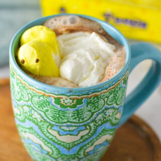 Peeps Hot Chocolate in a large coffee mug, with a packet of peeps marshmallows in the background.
