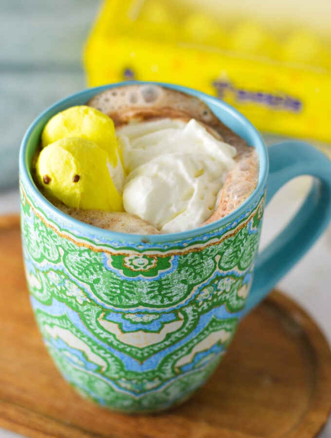 Peeps Hot Chocolate in a large coffee mug, with a packet of peeps marshmallows in the background.