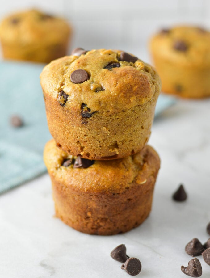 A stack of Healthy Peanut Butter Chocolate Chip Oat Muffins without any paper liners.