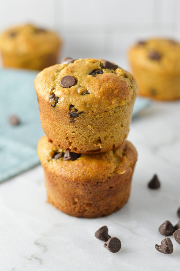 A stack of Healthy Peanut Butter Chocolate Chip Oat Muffins without any paper liners.