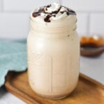A finished 2-ingredient chocolate milkshake made in the Ninja Slushi machine, served in a glass jar.